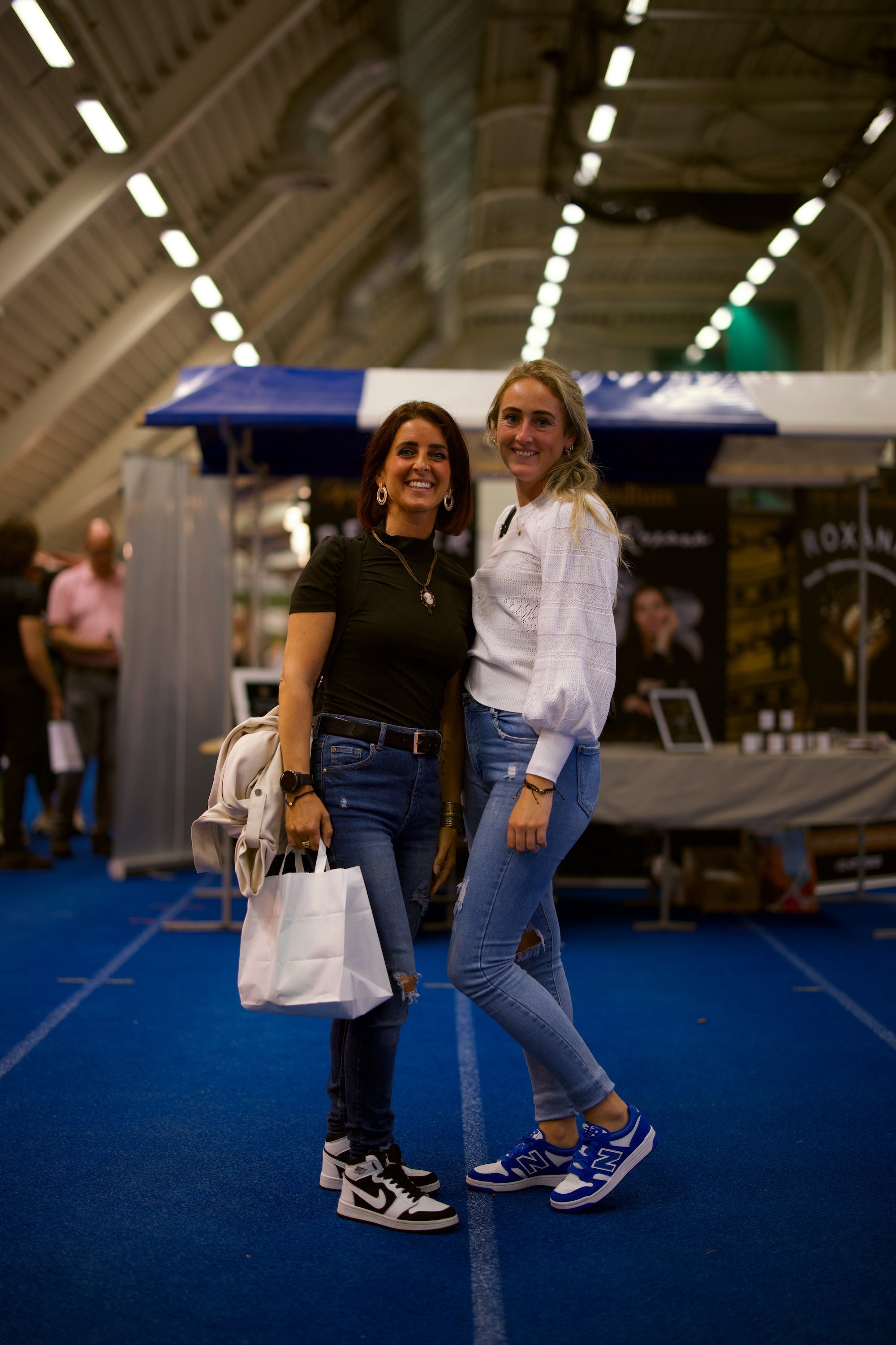 Spiritual Experience Event duo smiling with bag